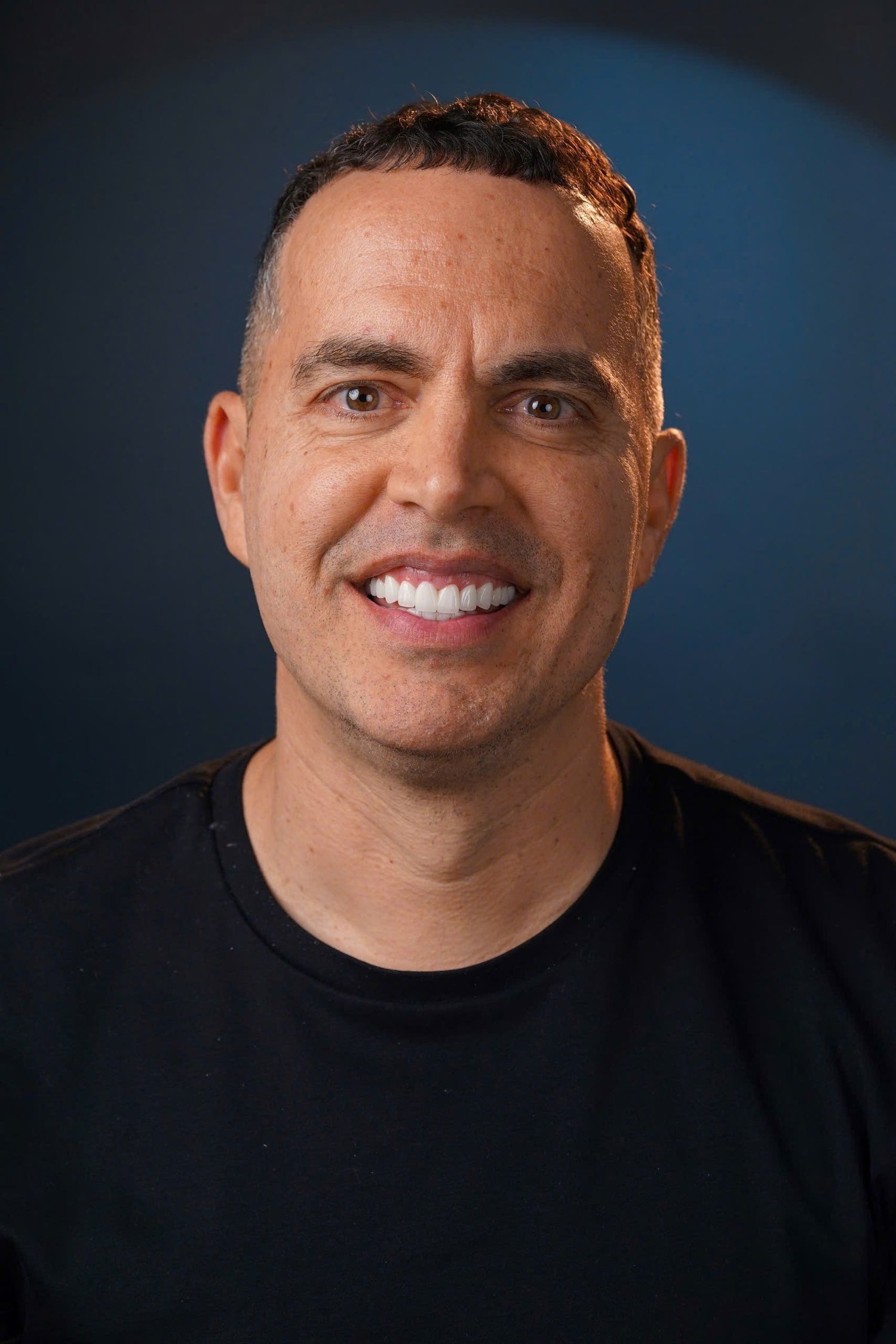 Image of an Australian men after a smile makeover with minimal prep veneers, zirconia crowns, dental implants at a leading dental clinic in Hanoi, Vietnam with Glamjet.com.au